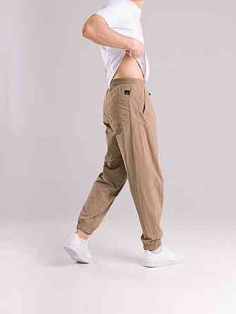 Чоловічі штани джогери з плащівки бежеві з кишенями Pobedov Ground Київ