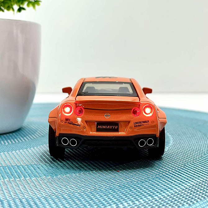 Машинка Auto Expert Nissan GTR металева 1:32 світло/звук/інерційна Жовтогаряча (38071) Чернігів - фото 9