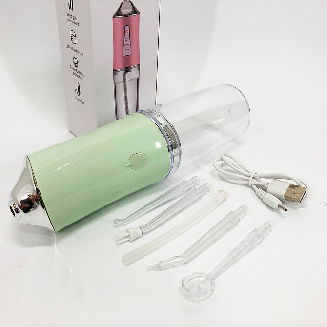 Іригатор для чищення зубів та порожнини рота Oral Irrigator з акумулятором та змінними насадками. YL-394 Колір: зелений Київ - фото 4