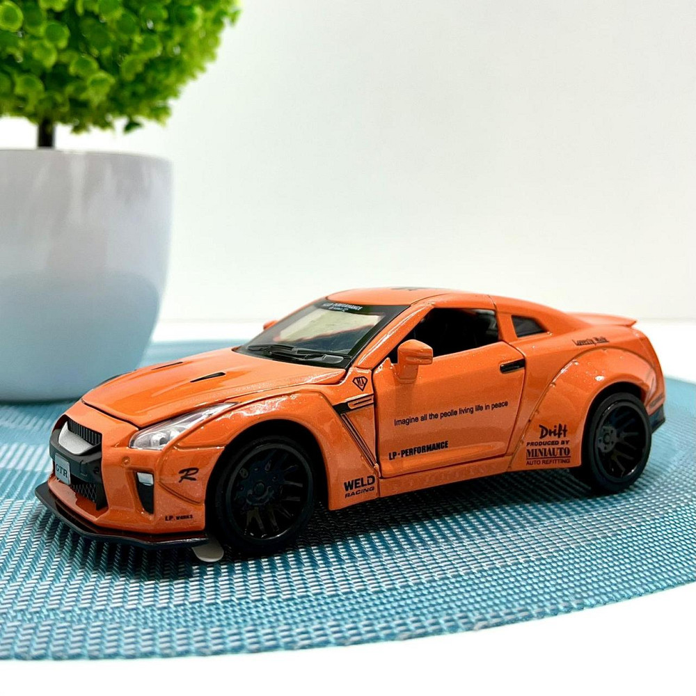 Машинка Auto Expert Nissan GTR металева 1:32 світло/звук/інерційна Жовтогаряча (38071) Чернигов - изображение 1
