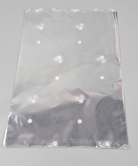 Пакет із малюнком для пакування подарунків (25*40) No427 (7) фольгований (ажурний) "Ромашка в росі" (100 шт.) Харків - фото 1