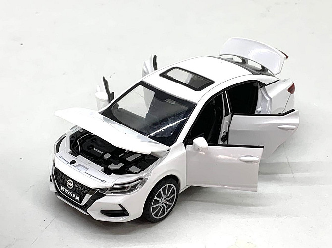 Машина Автосвіт Nissan selfie інерційна масштаб 1:32 відчиняються двері капот багажник 15 см Біла (AP-2084) Чернігів - фото 4