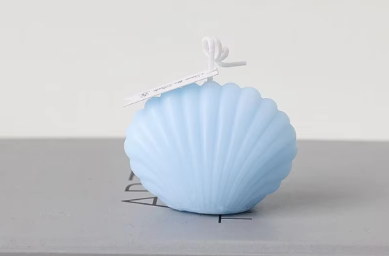 Свеча “Морская ракушка” ручной работы голубого цвета Каменец-Подольский