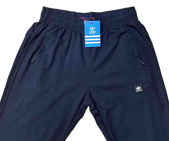 Мужские  зауженные  штаны Adidas ,ткань капа. Киев