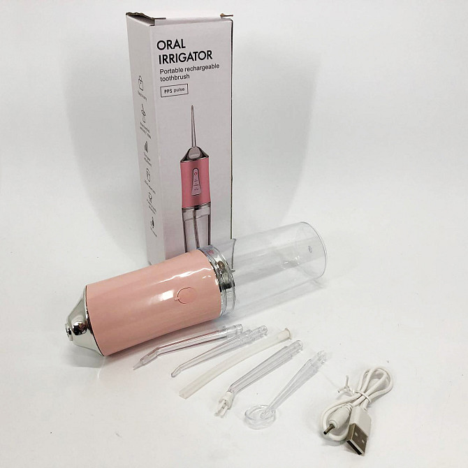 Ирригатор для чистки зубов и полости рта Oral Irrigator с аккумулятором и сменными насадками. Цвет: розовый UZ-30 Львов - изображение 6