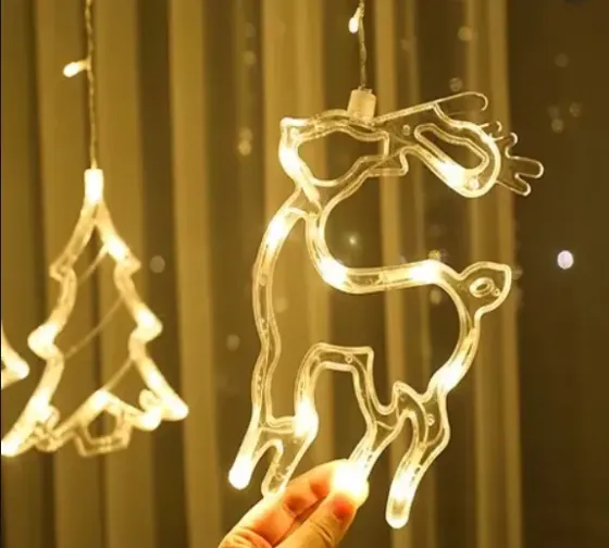 Гирлянда Штора с формами колокольчик, елка, олень 12 PCS light Коломия