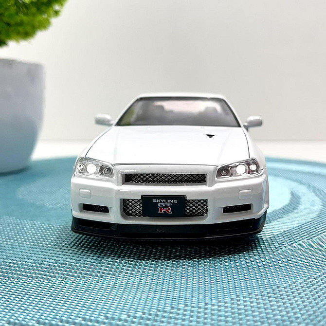 Машинка металева Авто Експерт Nissan GT-R 1:24 світло/звук відчиняються двері капот багажник Біла (1990-21) Чернігів - фото 3