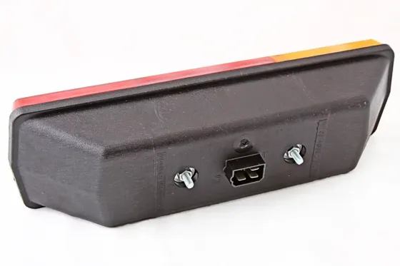 Фонарь  КамАЗ ВЗА левый (с подсветкой заднего номера) Винница