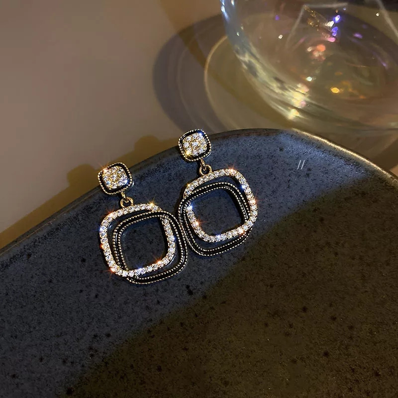 Жіночі сережки гвоздики 35 на 20 мм золотисто-чорний Київ - фото 1