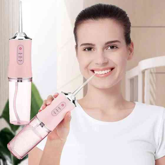 Ирригатор для чистки зубов и полости рта Oral Irrigator с аккумулятором и сменными насадками. Цвет: розовый UZ-30 Львов