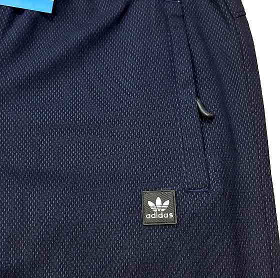 Мужские  зауженные  штаны Adidas ,ткань капа. Киев