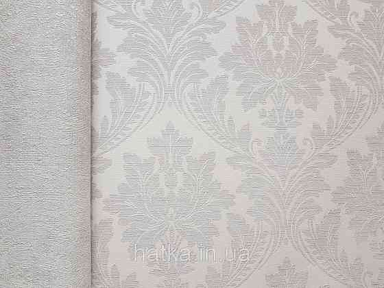 Шпалери вінілові на флізеліні Grandeco Time метрові структурні вензелю завитки бежеві на біло молочному Київ