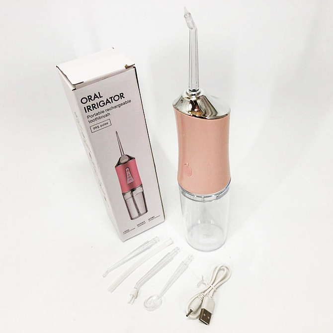 Іригатор для чищення зубів та порожнини рота Oral Irrigator з акумулятором та змінними насадками. VC-562 Колір: рожевий Київ - фото 9
