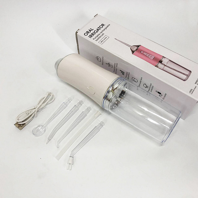 Ирригатор для чистки зубов и полости рта Oral Irrigator с аккумулятором и сменными насадками. Цвет: белый KA-31 Львов - изображение 6