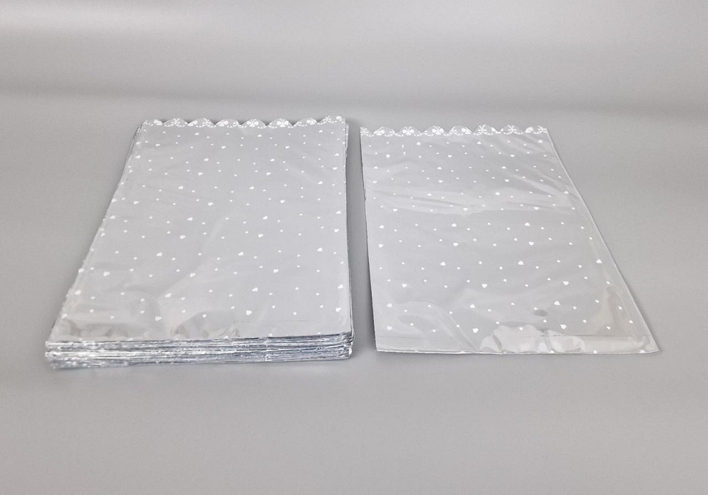 Пакет із малюнком для пакування подарунків (25*40) No427 (5) фольгований (ажурний) "Сердечка" (100 шт.) Харків - фото 1