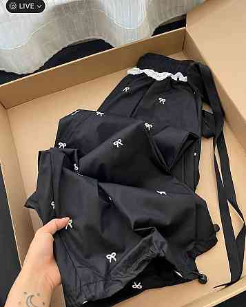 Женские стильные оверсайз брюки карго с бантиками отделаны кружевом плащевка Черный Одесса