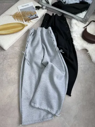 Теплые женские спортивные штаны оверсайз на флисе со шнуровкой по бокам снизу на затяжках Харьков