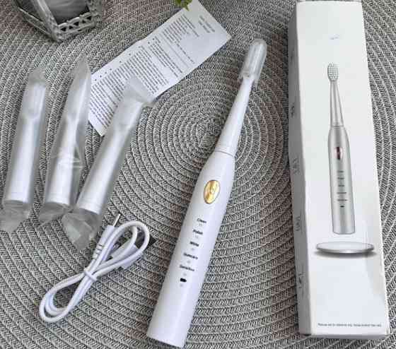 Электрическая зубная щетка. Киев