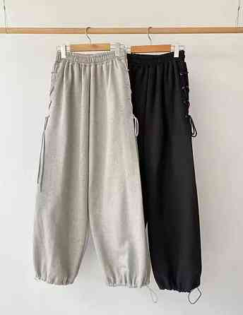 Женские очень широкие оверсайз брюки с акцентной шнуровкой по бокам Черный Одесса