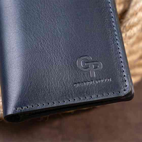 Вертикальне глянсове портмоне з накладною монетницьою GRANDE PELLE 11332 Синє Київ