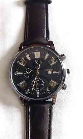 Подарочный набор для мужчин: наручные часы с 3 ориг. браслетами- диам 4см, длин 24см, шир рем 2см, без коробки Киев