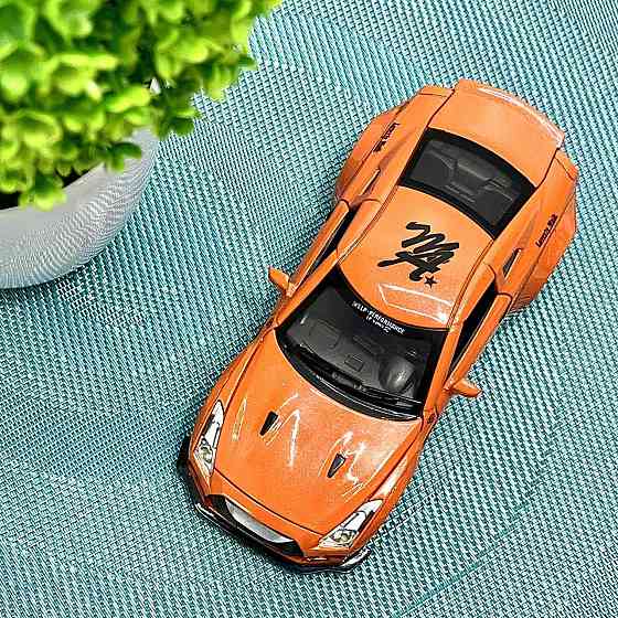Машинка Auto Expert Nissan GTR металева 1:32 світло/звук/інерційна Жовтогаряча (38071) Чернігів