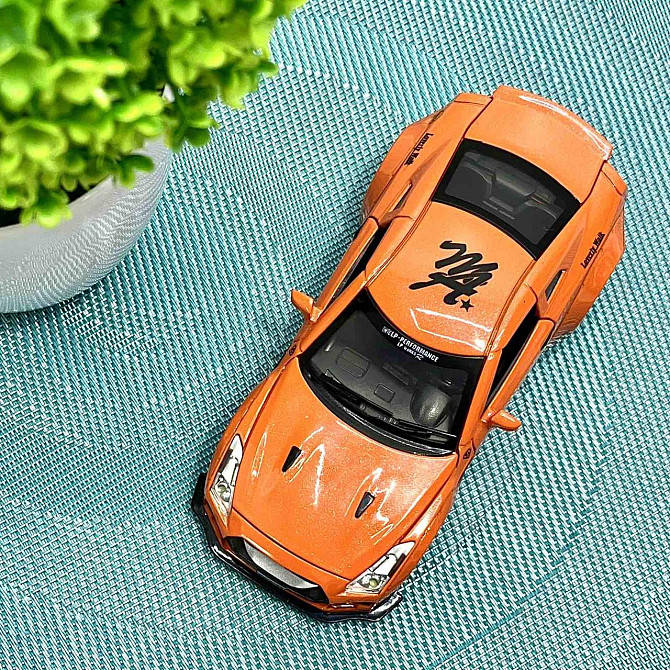 Машинка Auto Expert Nissan GTR металева 1:32 світло/звук/інерційна Жовтогаряча (38071) Чернігів - фото 3