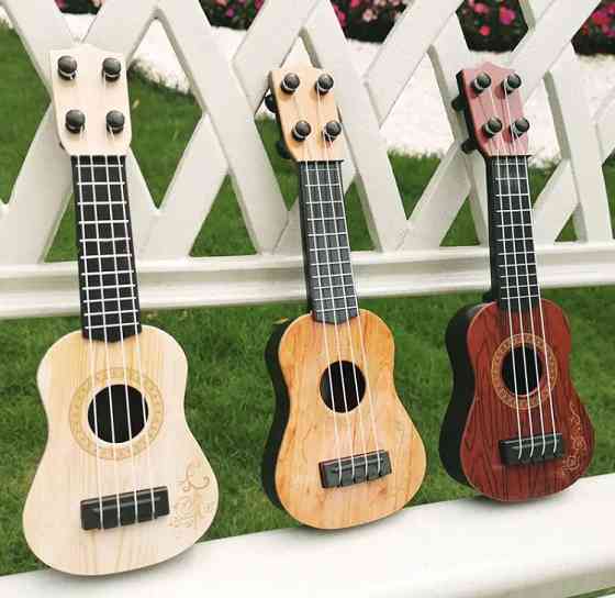 Гітара дитяча іграшка, бежева, дитяча укулеле, довжина - 25см, ширина 9см, пластик, 4 струни, унісекс, 3+ Київ