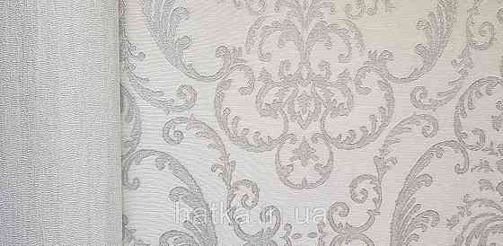 Шпалери вінілові на флізеліні AdaWall Seyyah 1.06х10 завитки вензеля великі структурні сріблясті на білому Київ