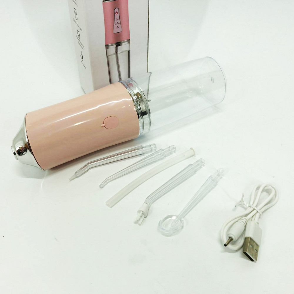 Іригатор для чищення зубів та порожнини рота Oral Irrigator з акумулятором та змінними насадками. Колір: рожевий MK-36 Львів - фото 13