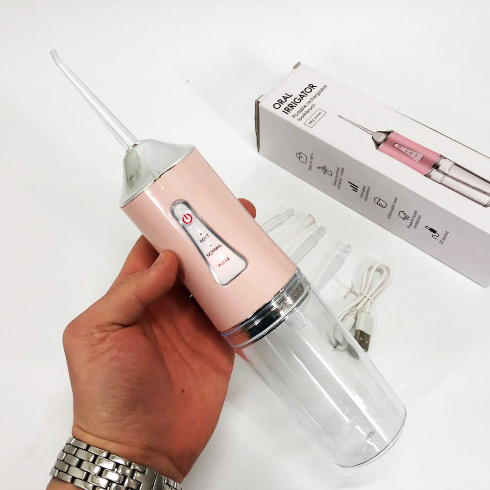 Іригатор для чищення зубів та порожнини рота Oral Irrigator з акумулятором та змінними насадками. Колір: рожевий MK-36 Львів - фото 14