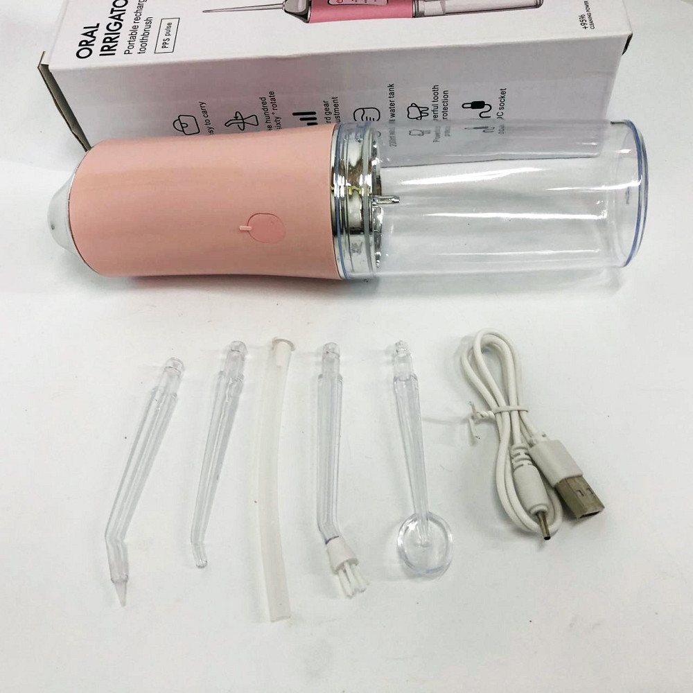 Іригатор для чищення зубів та порожнини рота Oral Irrigator з акумулятором та змінними насадками. Колір: рожевий MK-36 Львів - фото 12