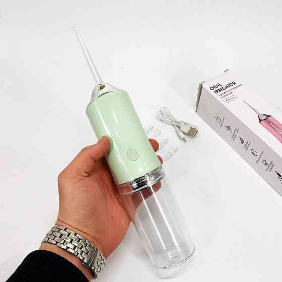 Іригатор для чищення зубів та порожнини рота Oral Irrigator з акумулятором та змінними насадками. YL-394 Колір: зелений Київ