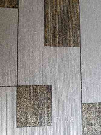 Текстильні шпалери на флізеліновій основі Cador Rasch Textil086545 сіро-бежева основа квадрати бронза Київ
