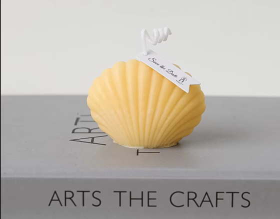 Свеча “Морская ракушка” ручной работы желтого цвета Каменец-Подольский