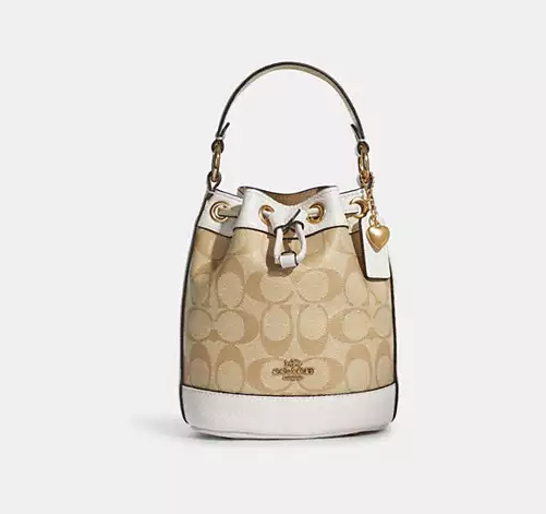 Жіноча сумка із фірмового полотна із підвіскою серце (Бежева) Київ - фото 1