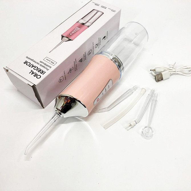 Ирригатор для чистки зубов и полости рта Oral Irrigator с аккумулятором и сменными насадками. Цвет: розовый UZ-30 Львов - изображение 8