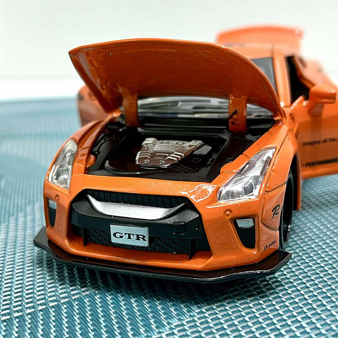 Машинка Auto Expert Nissan GTR металева 1:32 світло/звук/інерційна Жовтогаряча (38071) Чернігів - фото 2