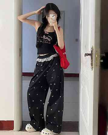 Женские стильные оверсайз брюки карго с бантиками отделаны кружевом плащевка Черный Одесса