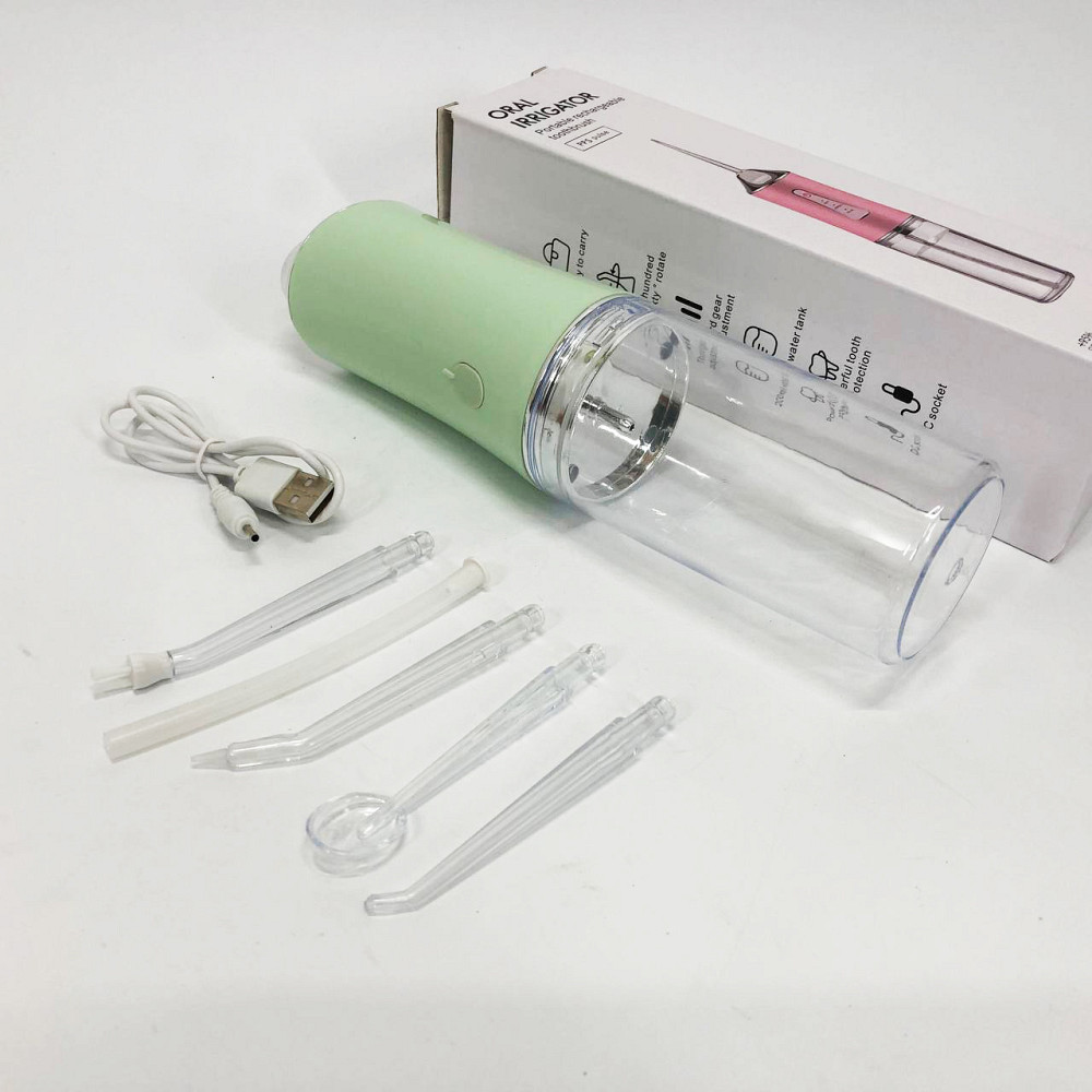 Ирригатор для чистки зубов и полости рта Oral Irrigator с аккумулятором и сменными насадками Green KM-82 Львов - изображение 20