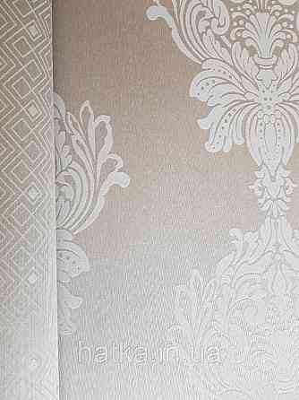Текстильні шпалери на флізеліновій основі Cador Rasch Textil 086774 вензелі бежевий молочний Київ