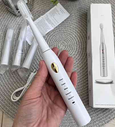 Электрическая зубная щетка. Киев