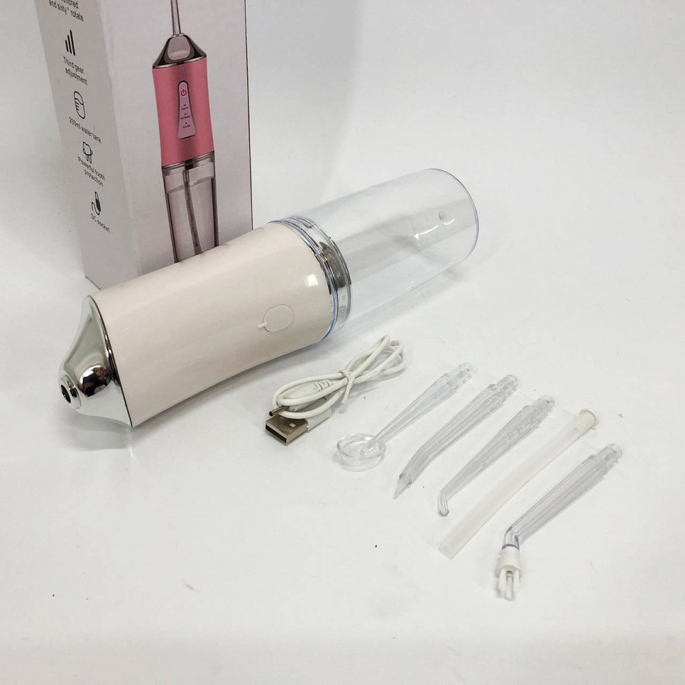 Ирригатор для чистки зубов и полости рта Oral Irrigator с аккумулятором и сменными насадками. Цвет: белый HK-42 Львов - изображение 14