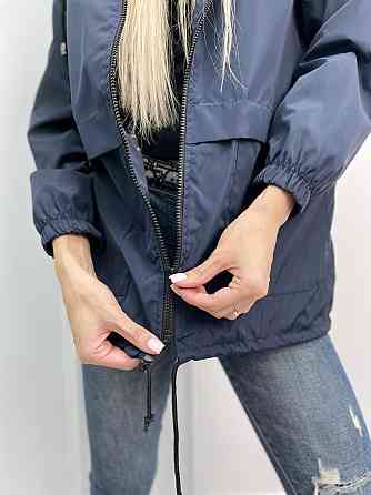 Жіноча вітровка на підкладці з капюшоном "Tysson" оптом | Норма і батал | Розпродаж моделі Київ