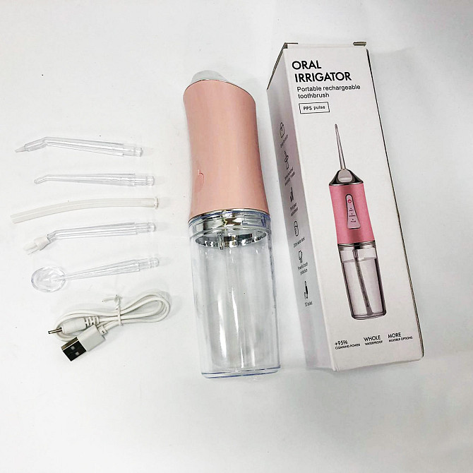 Іригатор для чищення зубів та порожнини рота Oral Irrigator з акумулятором та змінними насадками. VC-562 Колір: рожевий Київ - фото 4