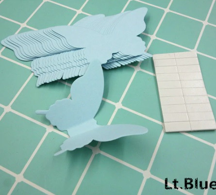 Декор стін метелики світло-блакитні - у наборі 20 штук розміром 8*5см, картон, є 2-х сторонній скотч Київ - фото 1