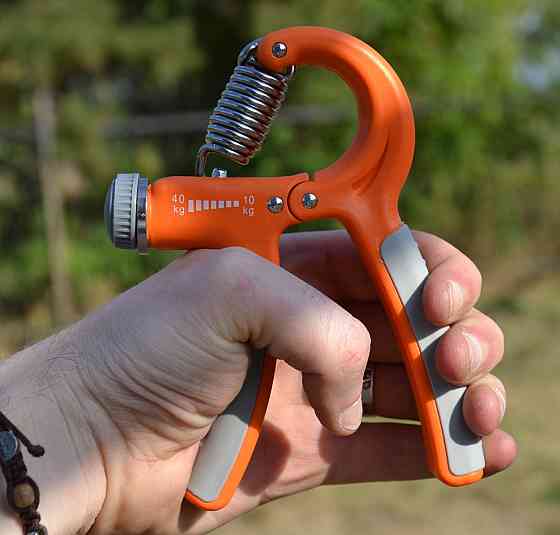 Еспандер кистьовий Power System PS-4021 з регульованим навантаженням 10-40 кг.  Power Hand Grip Orange Кам'янське