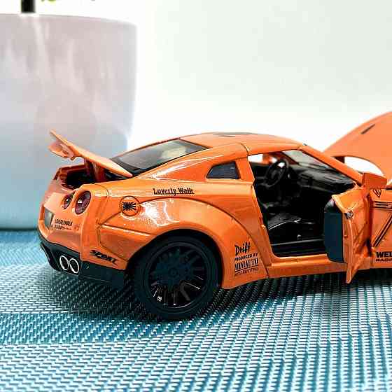 Машинка Auto Expert Nissan GTR металева 1:32 світло/звук/інерційна Жовтогаряча (38071) Чернігів
